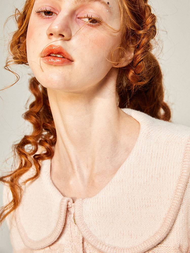 桜色の編み柄ニットジャケット