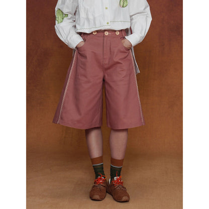 煉瓦色の刺繍ストラップパンツ