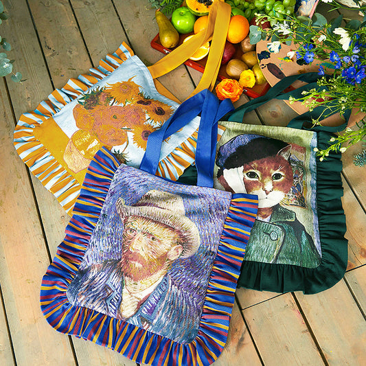 花瓶の向日葵とゴッホの自画像と包帯をした猫の自画像のトートバッグ