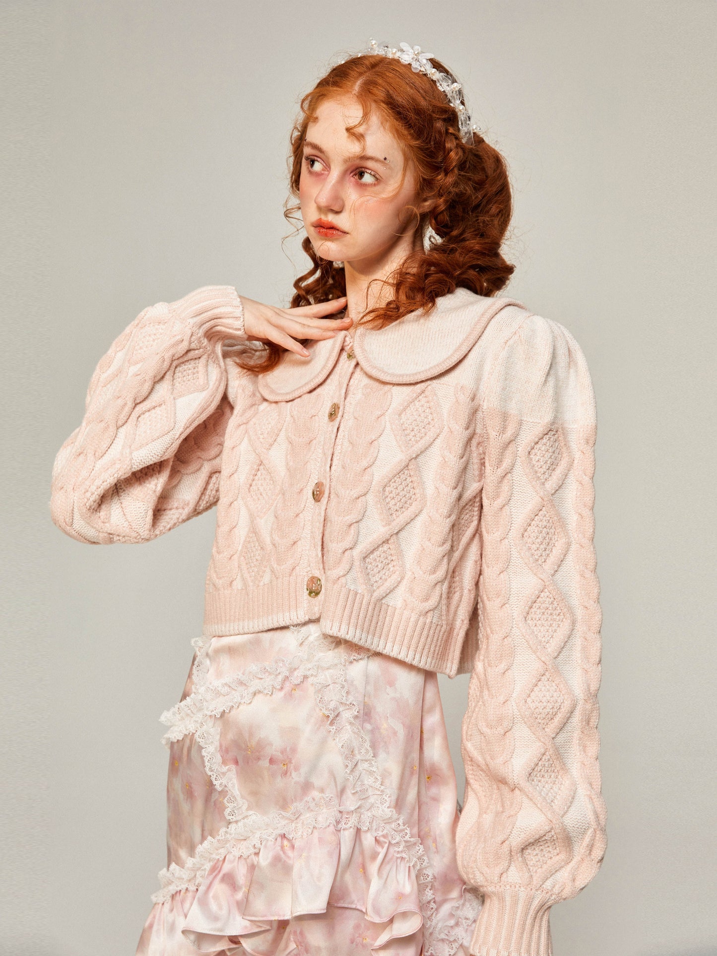 桜色の編み柄ニットジャケット