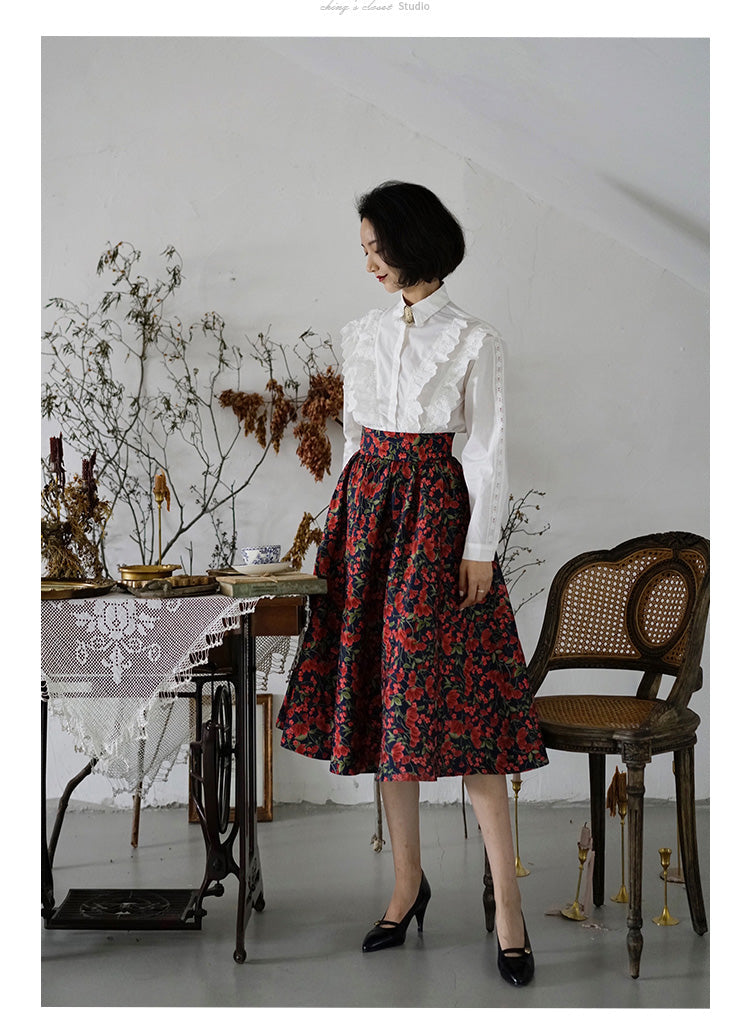 Jacquard skirt with red flowers blooming in ultramarine blue