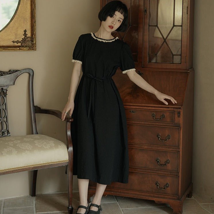 Back bow hollowed-out short-sleeved lantern-sleeved little black dress