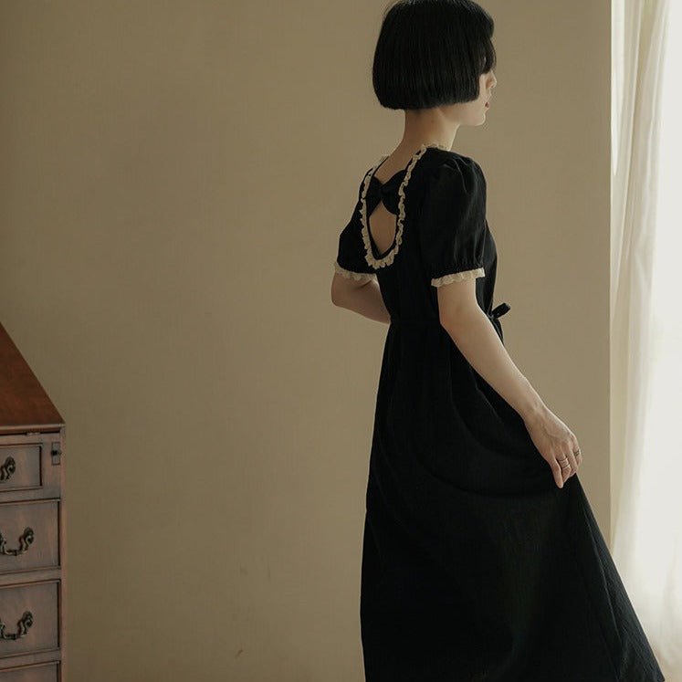 Back bow hollowed-out short-sleeved lantern-sleeved little black dress