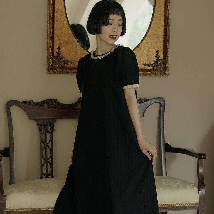 Back bow hollowed-out short-sleeved lantern-sleeved little black dress