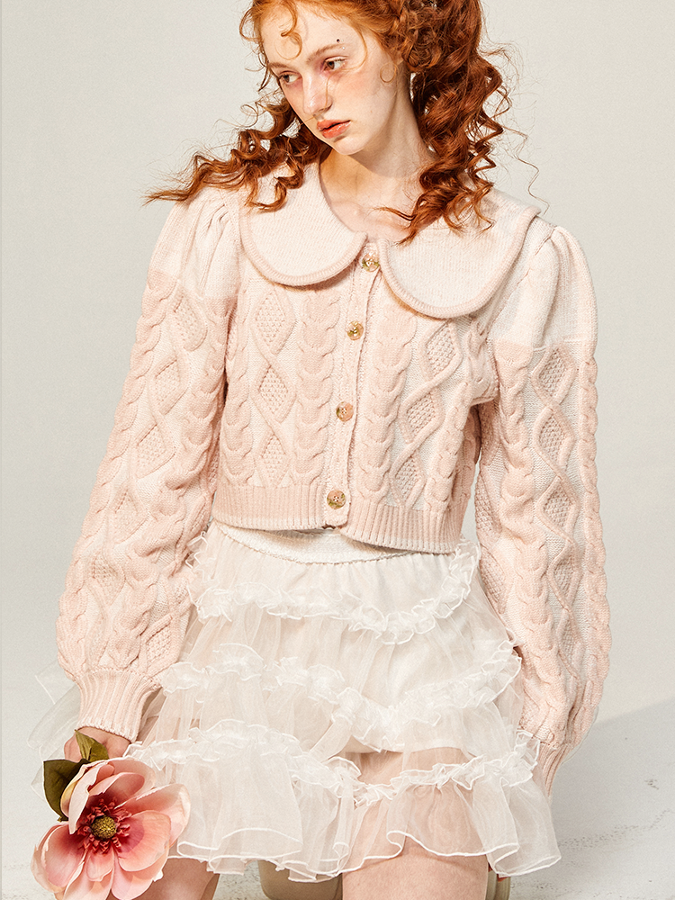 桜色の編み柄ニットジャケット