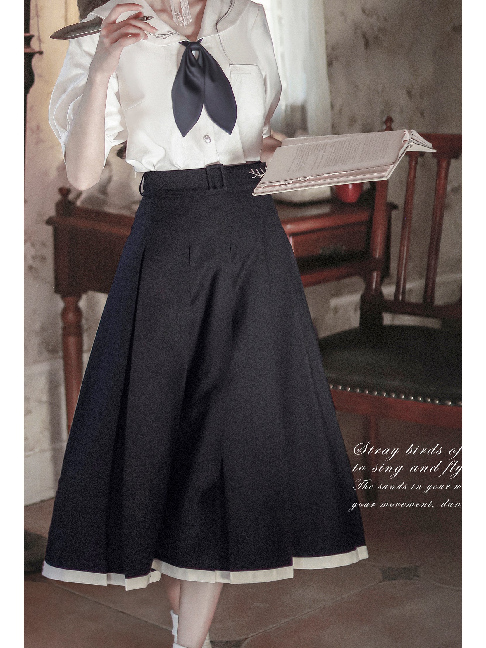 white-black lady's literary sailor blouse and pleated skirt