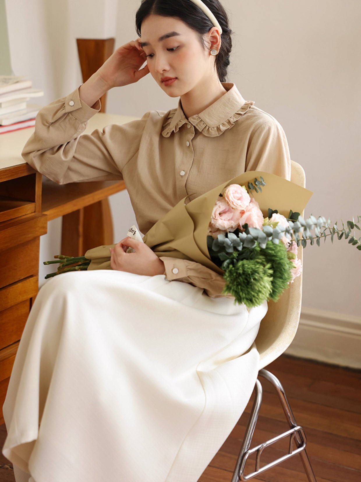Apricot-colored lady's pleated skirt