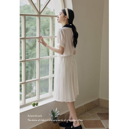 White lily blouse and pleated skirt